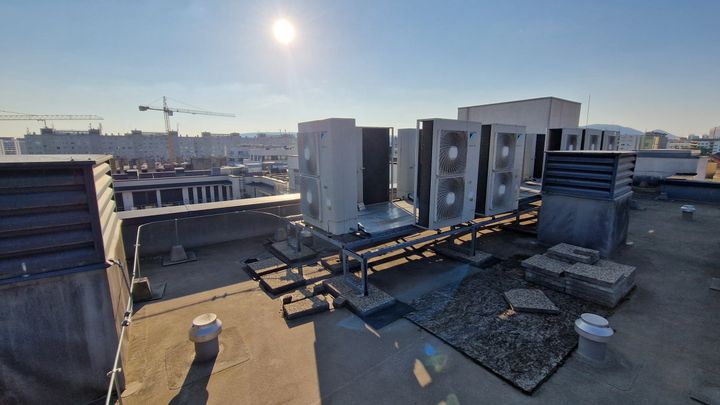 Daikin Altherma heat pumps installed on the roof of a residential building